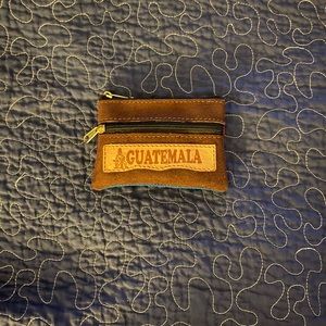 Small brown and other colors genuine suede leather coin wallet from Guatemala.